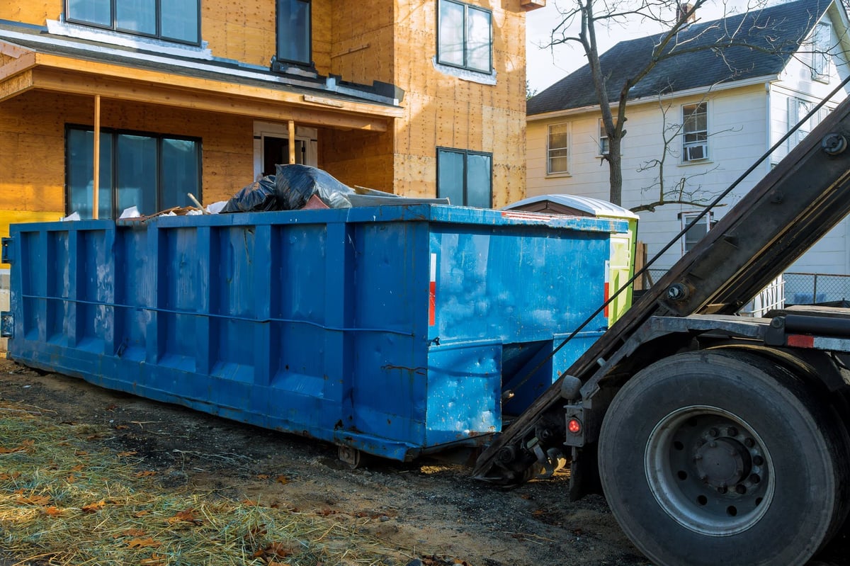 Loaded container of household items and clutter ready for hauling