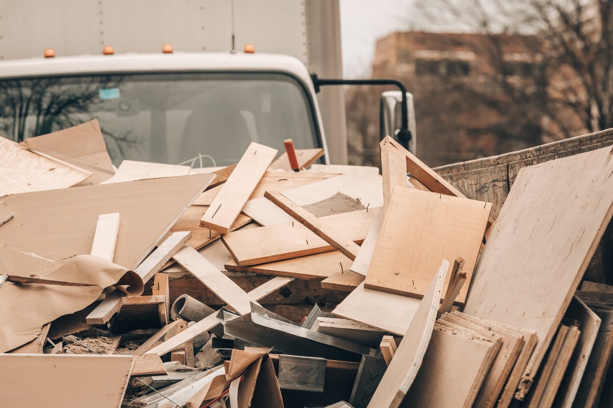 Work vehicle and debris materials at a cleanup job site